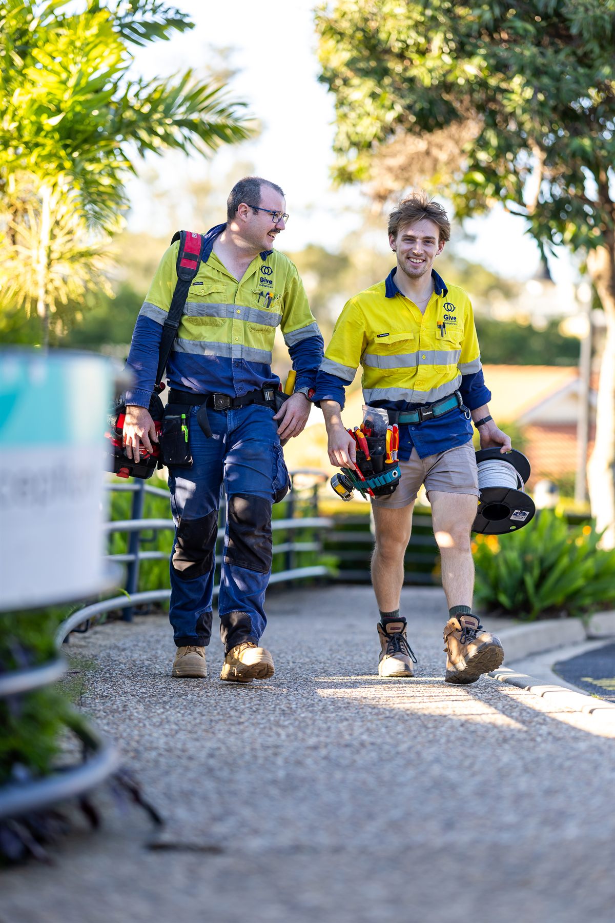 Give Industries team members in high visibility workwear