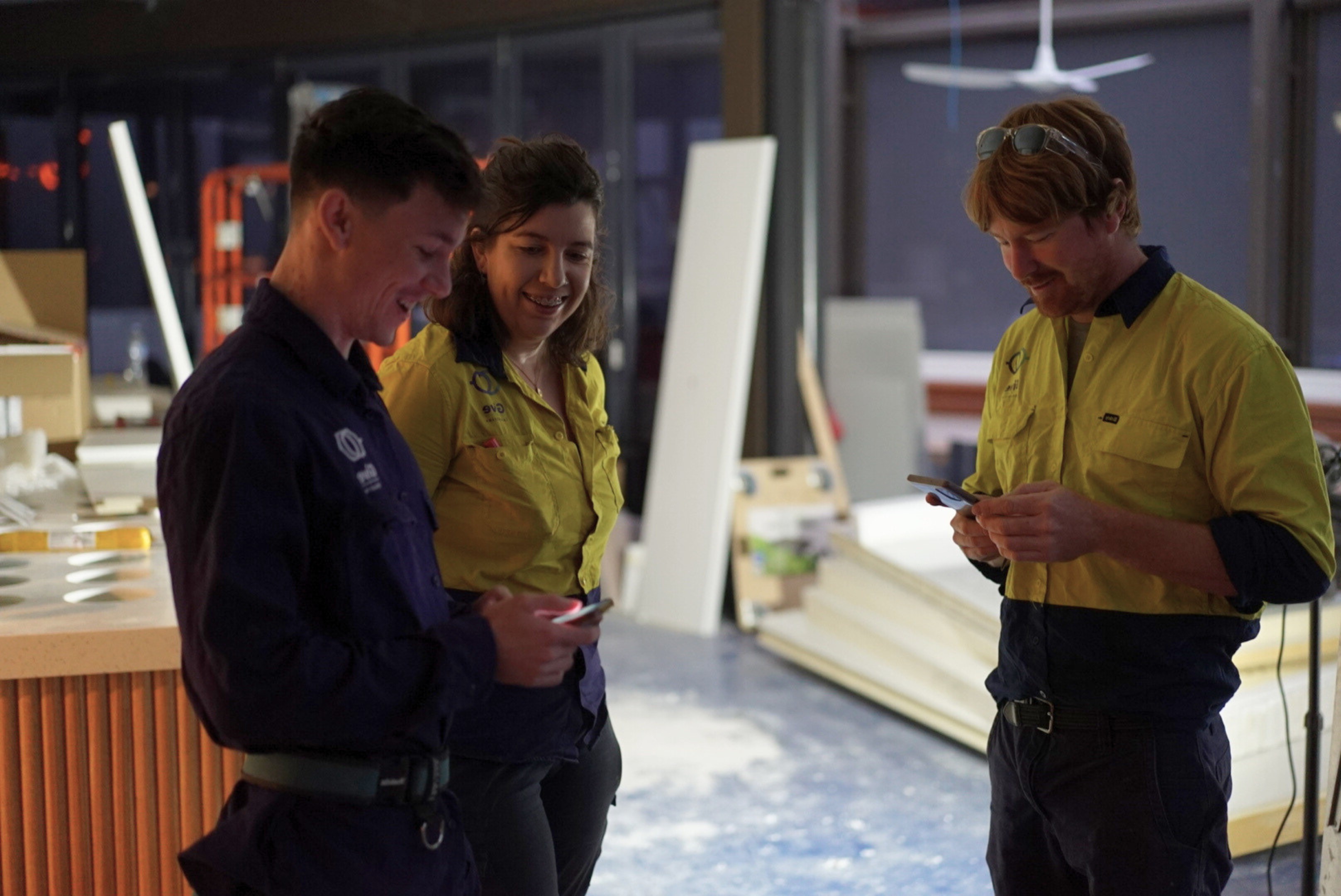 Give Industries electrician reviewing plans on site